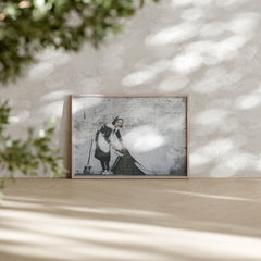 Banksy-inspired Maid wall art print of housemaid sweeping under the wall
