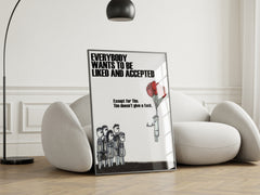 Framed poster with text and illustration on a white wall in a modern living room.