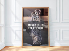 Framed poster with a kitten and tiger reflection and 'Mindset is Everything' text on a white wall.
