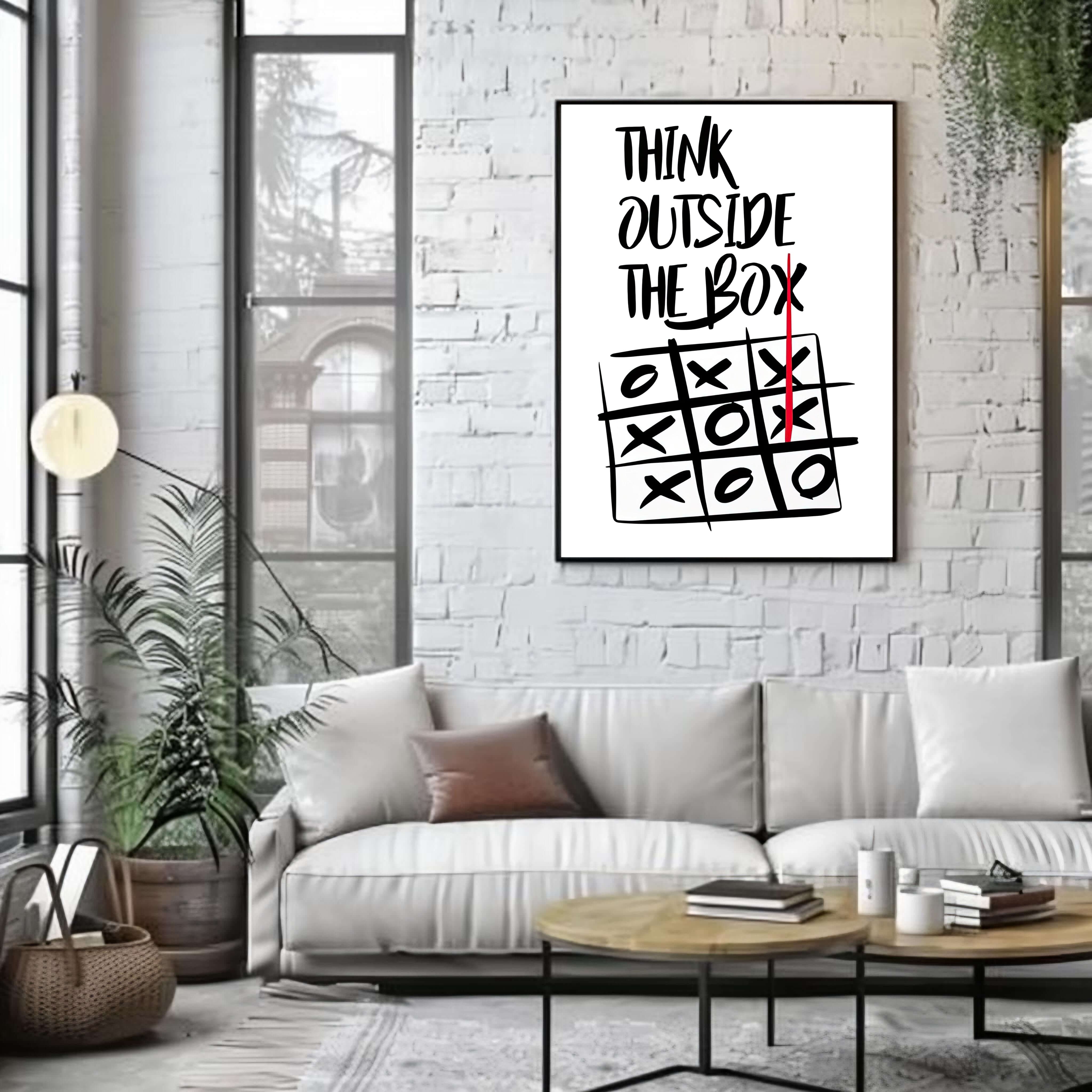 Living room with a white couch, coffee table, and framed crossword puzzle poster on a brick wall.