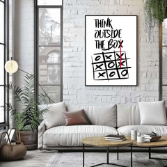 Living room with a white couch, coffee table, and framed crossword puzzle poster on a brick wall.