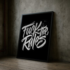 Framed poster with 'Fuck the Rules' text on a concrete wall.