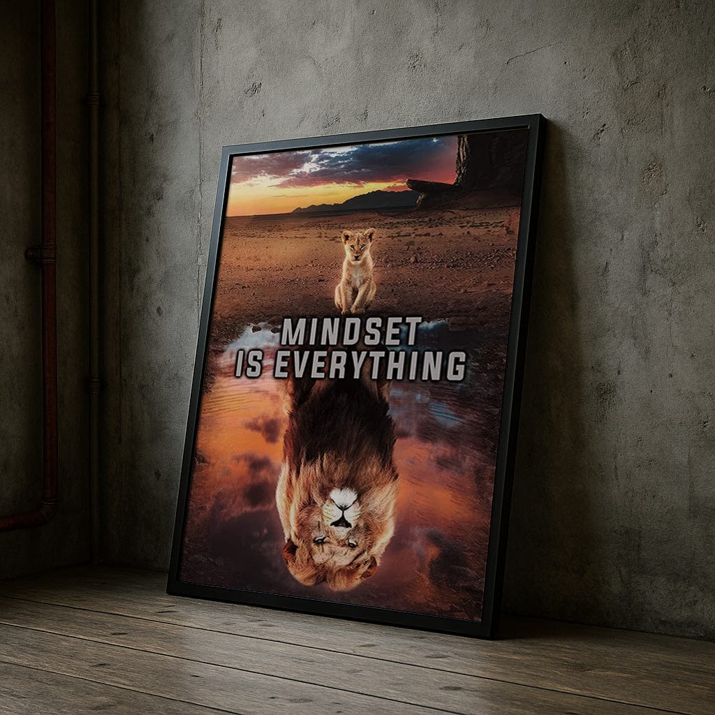 Framed poster with a lion and reflection, featuring the text 'Mindset is Everything', leaning against a textured wall.