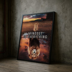 Framed poster with a lion and reflection, featuring the text 'Mindset is Everything', leaning against a textured wall.