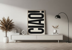 Modern living room with a 'CIAO!' poster on a white wall.