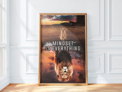 Framed poster with a lion and the quote 'MINDSET IS EVERYTHING' on a white wall.