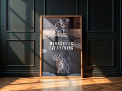 Framed poster with a cat and tiger reflection and 'Mindset is Everything' text on a dark wall.