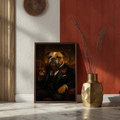 Framed portrait of a dog in formal attire next to a gold vase with decorative branches on a red wall.