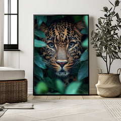 Framed artwork of a leopard surrounded by leaves in a modern room.