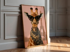 Framed artwork of a giraffe wearing sunglasses with the Eiffel Tower in the background, leaning against a wall.