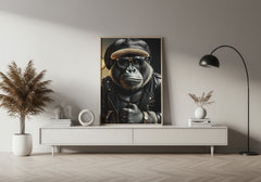 Modern interior with a framed picture of a gorilla wearing sunglasses and a hat on a white wall.