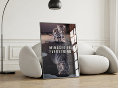 Poster with a cat and tiger and 'Mindset is Everything' text in a modern living room.