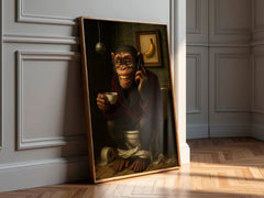 Framed artwork of a monkey on the phone with a cup in a room with wooden floor and white walls.