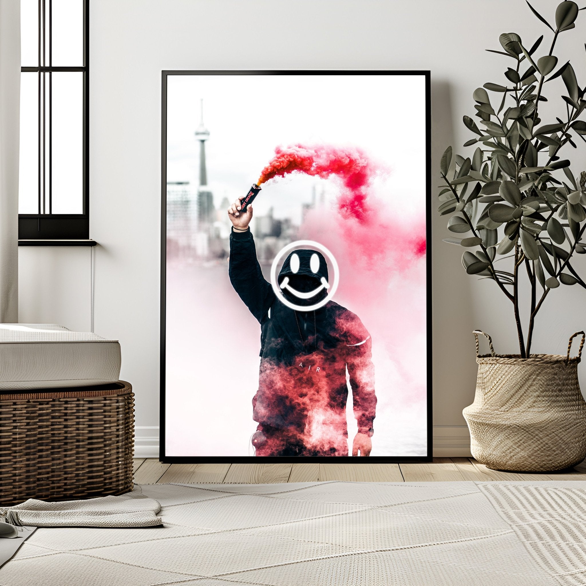 Framed artwork of a person holding a smoke bomb with a smiley face in a modern room.