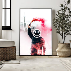Framed artwork of a person holding a smoke bomb with a smiley face in a modern room.