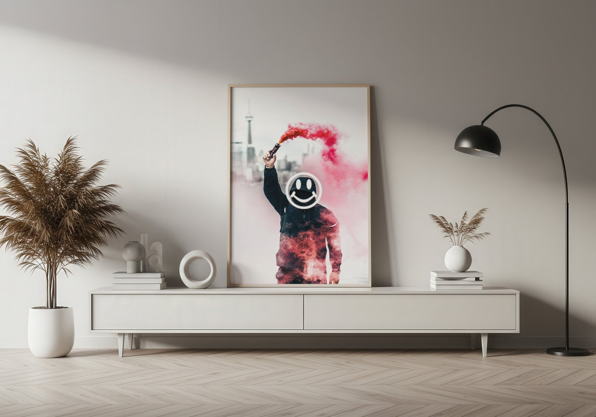 Modern living room with a white console table, decorative plant, and framed artwork.