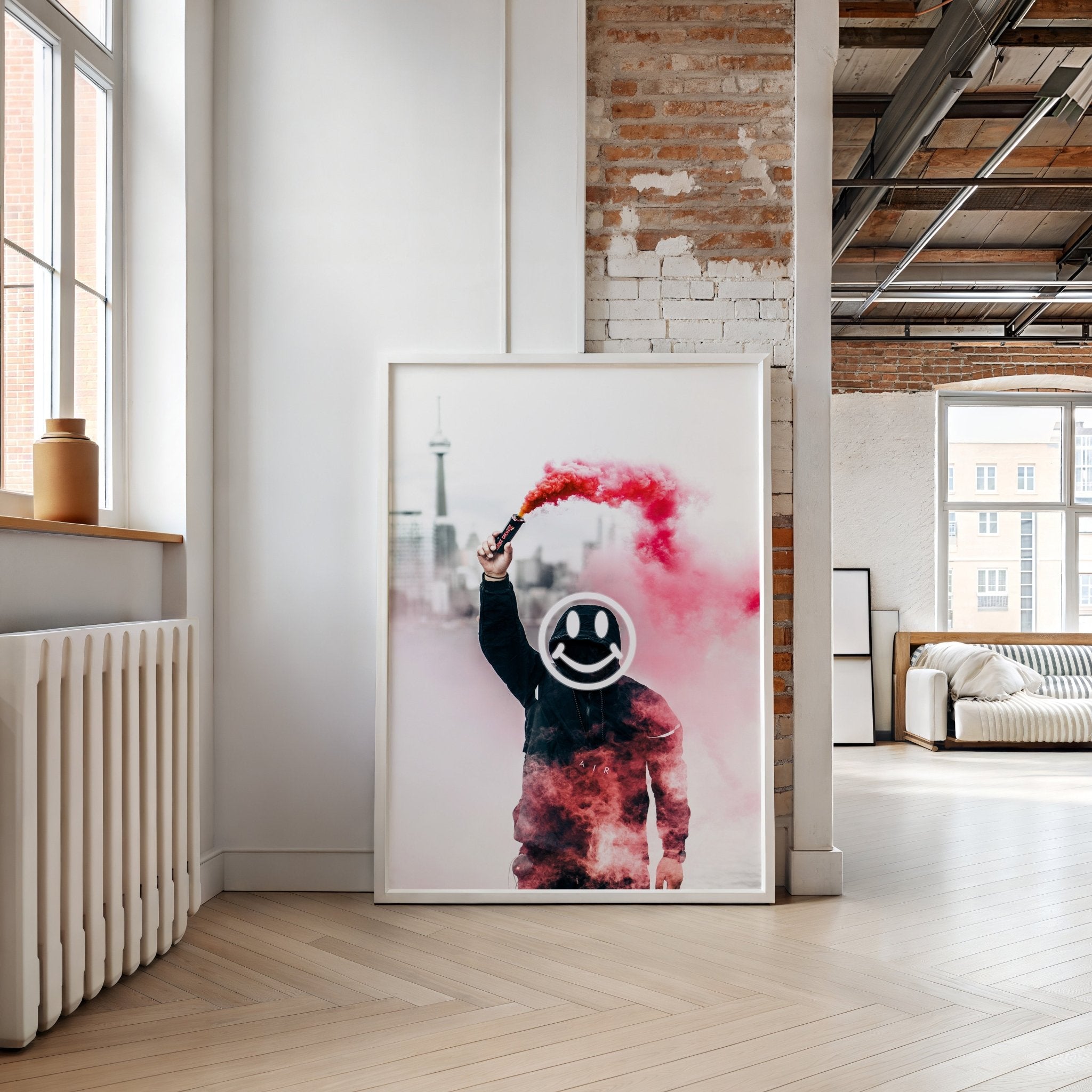 Framed artwork of a person holding a smoke bomb with a smiley face in a modern room.