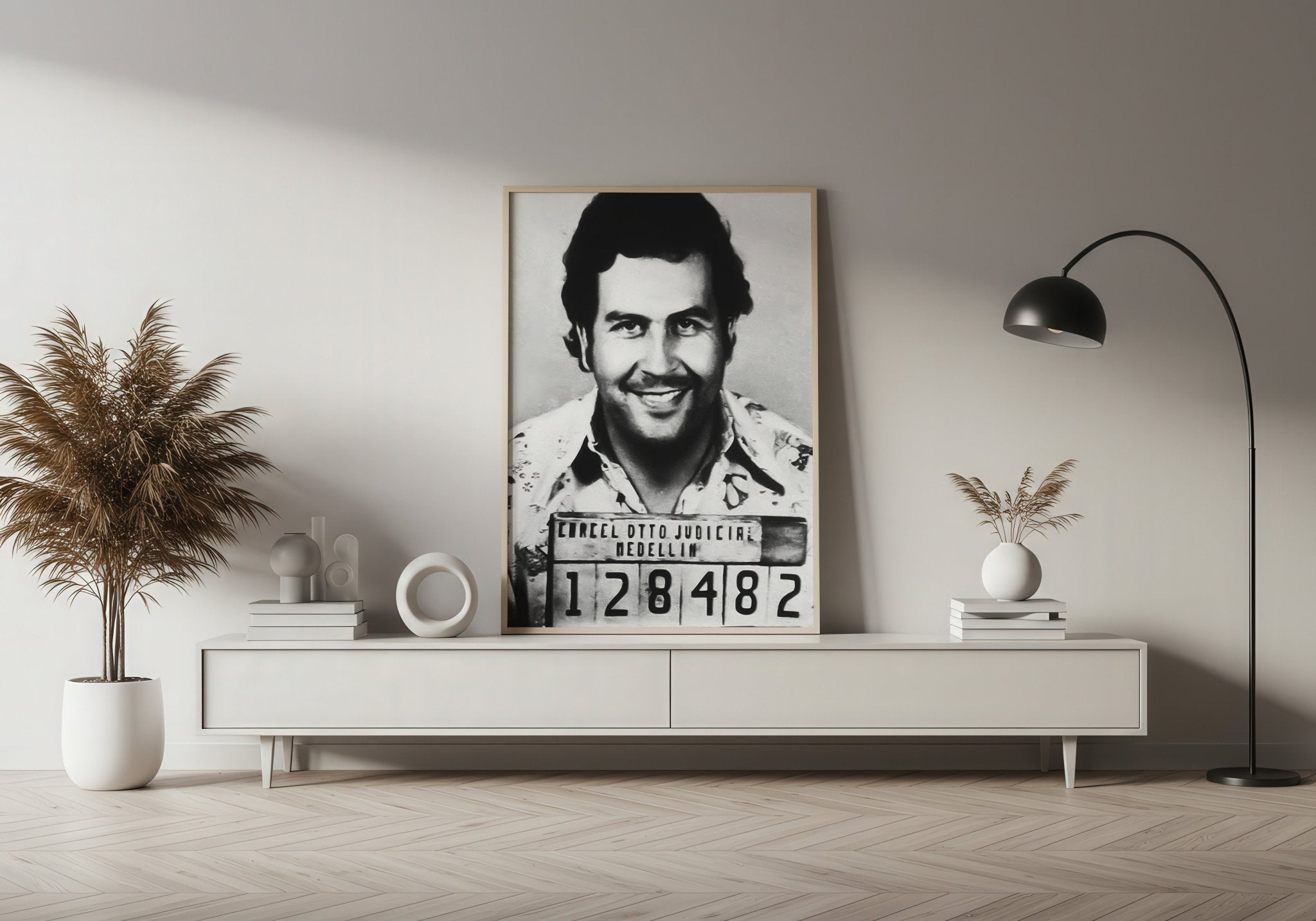 Framed mugshot of a man on a wall in a modern living room.