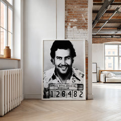 Framed black and white portrait of a man in a room with modern decor.