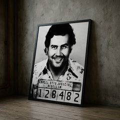 Framed black and white mugshot of a man on a textured wall.