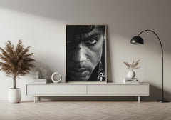 Modern living room with a framed portrait above a white console table.