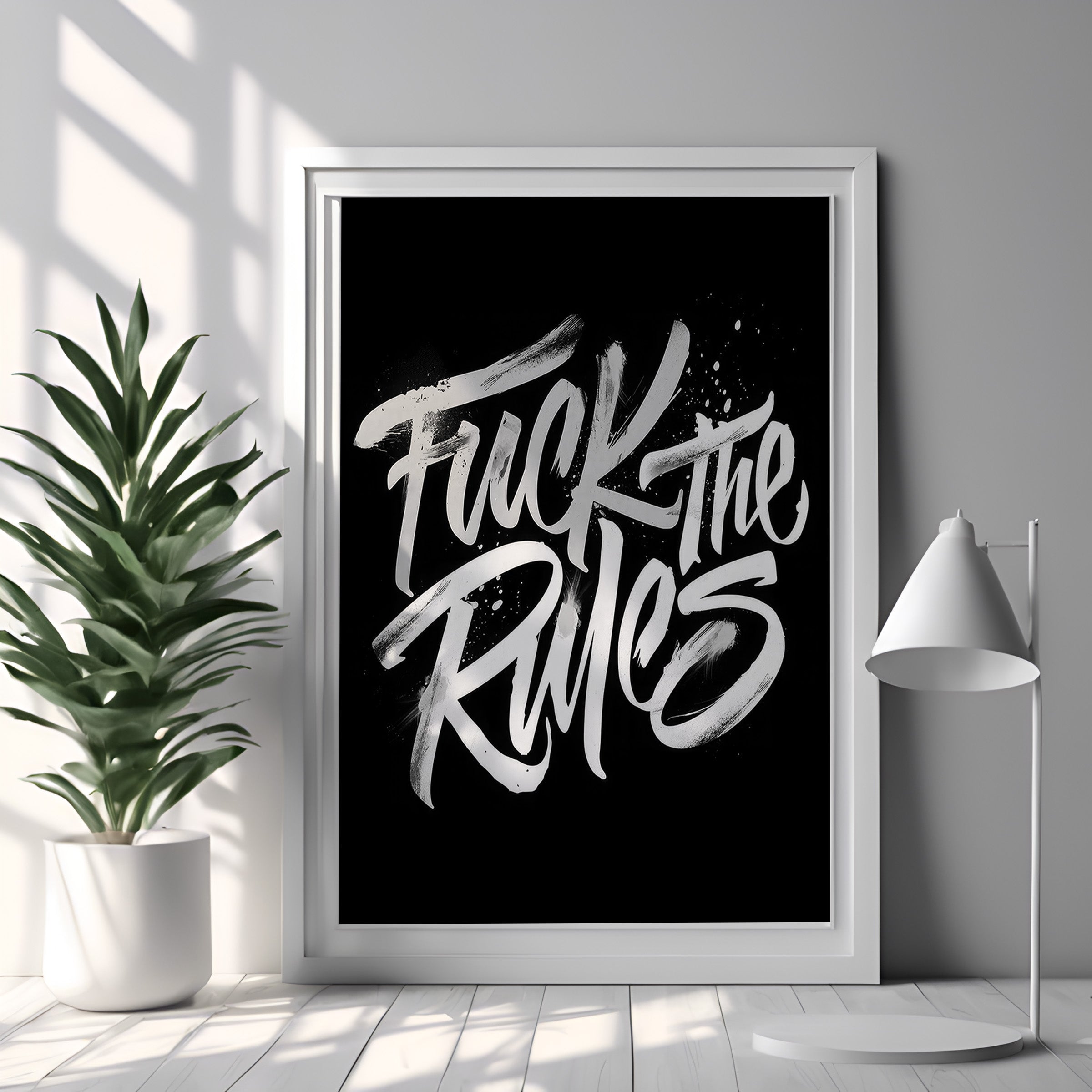 Framed poster with 'Fuck the Rules' text in a modern interior setting