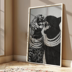 Black and white wall art print of roaring cheetah and panther wearing glamorous pearl necklaces.