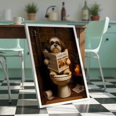 Framed picture of a dog on a toilet with a newspaper in a kitchen setting