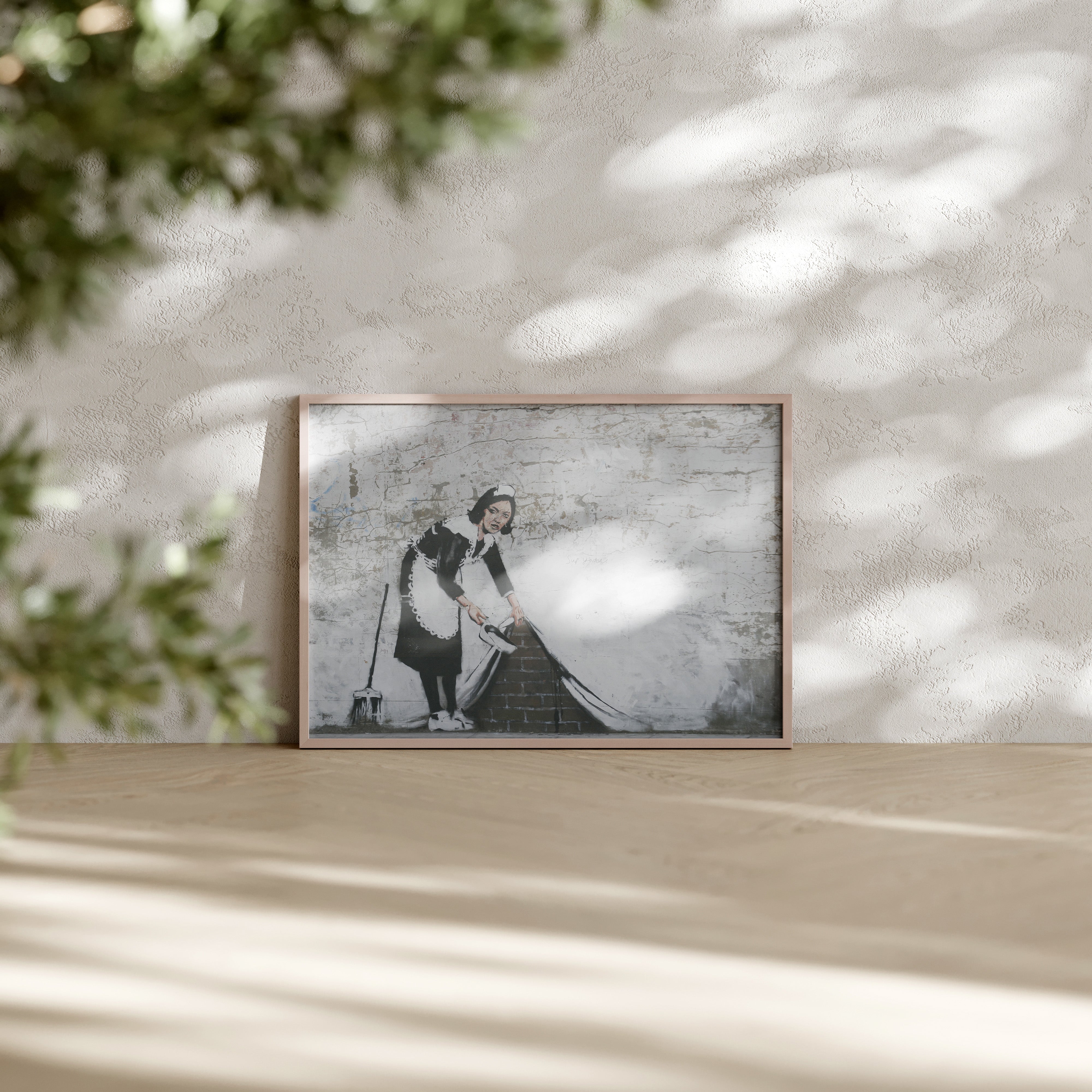 Banksy-inspired Maid wall art print of housemaid sweeping under the wall