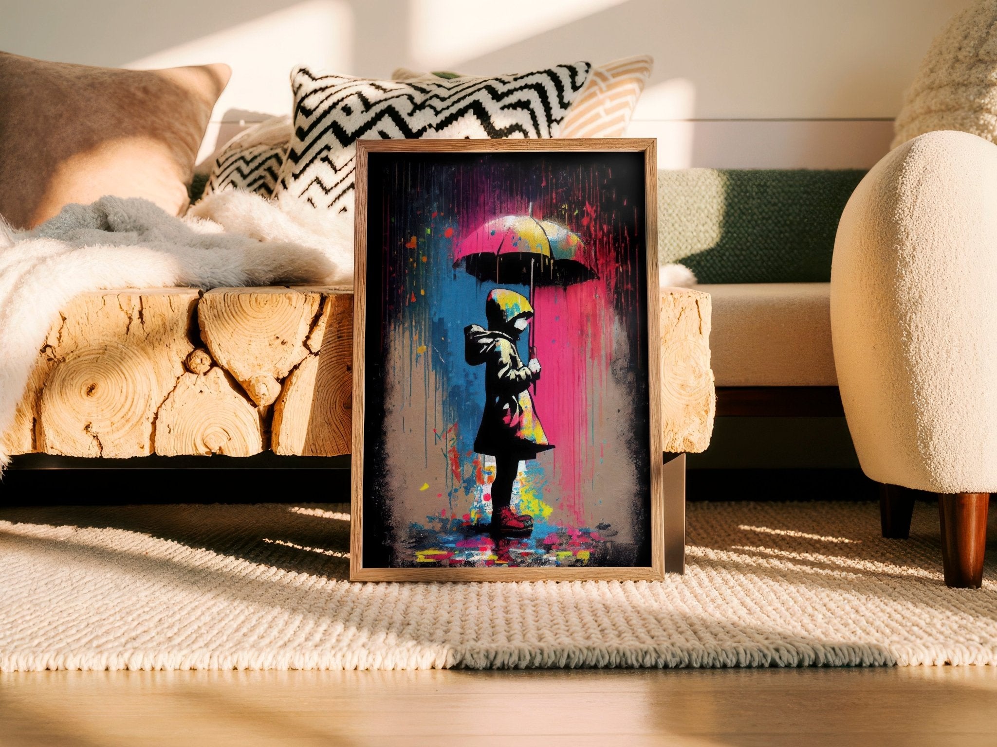 Framed artwork of a colorful rain scene with a child holding an umbrella in a living room setting.