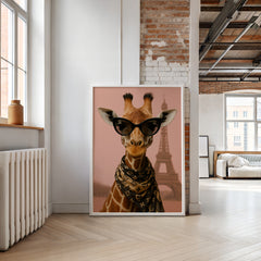 Framed artwork of a giraffe wearing sunglasses with the Eiffel Tower in the background, hanging on a wall.