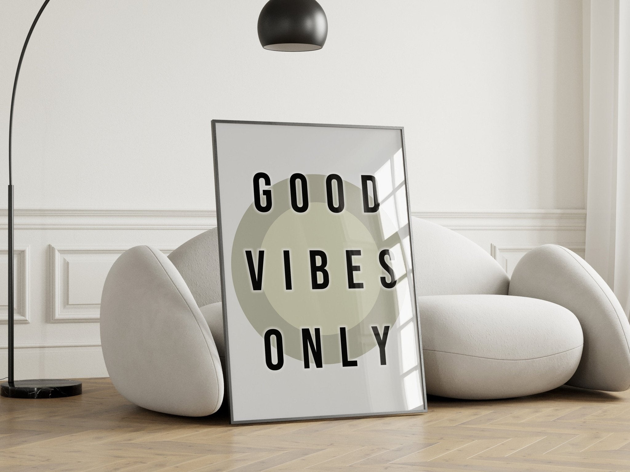 Framed 'Good Vibes Only' poster on a wall with modern decor.