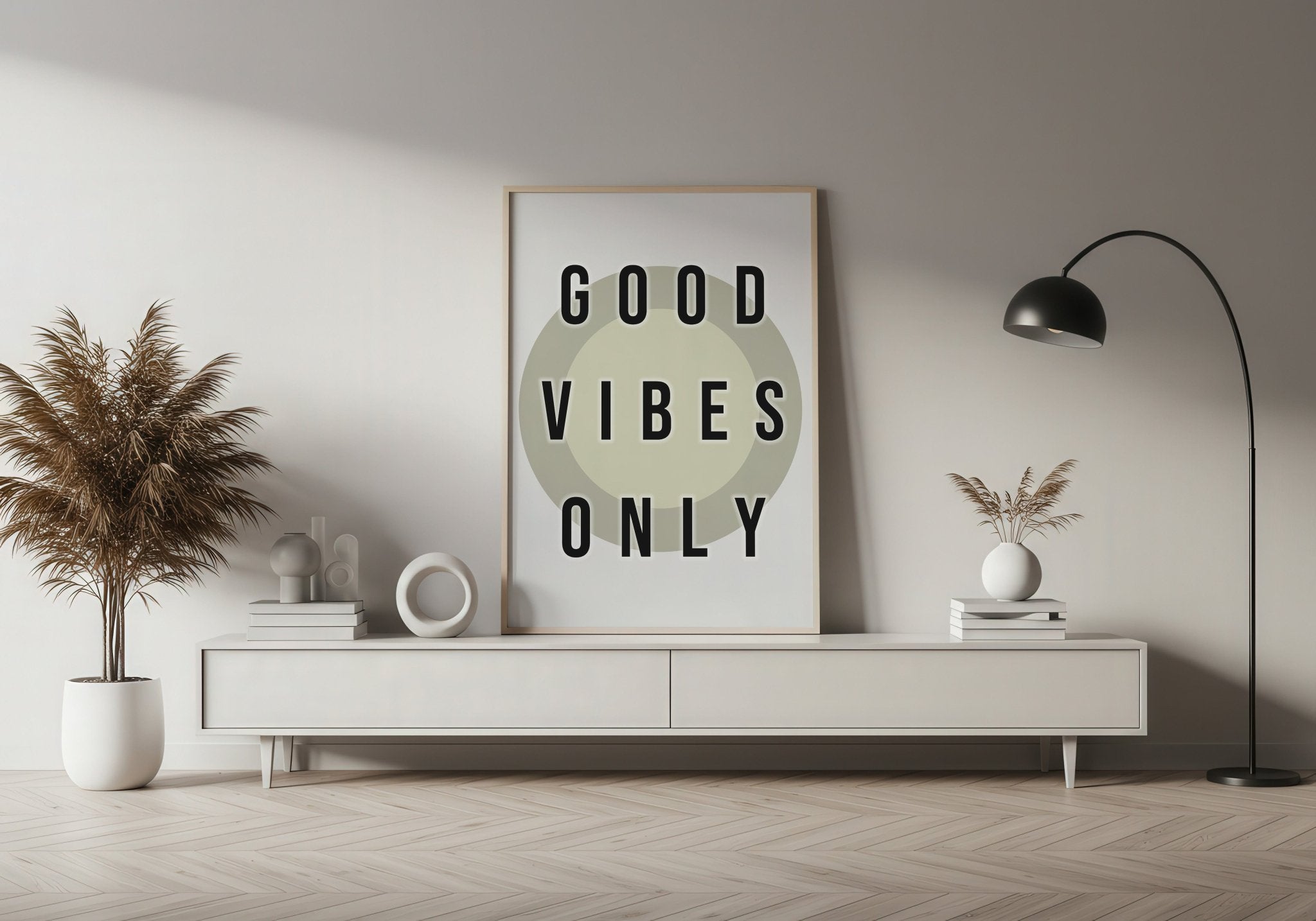 Modern living room with 'Good Vibes Only' poster on a white wall.