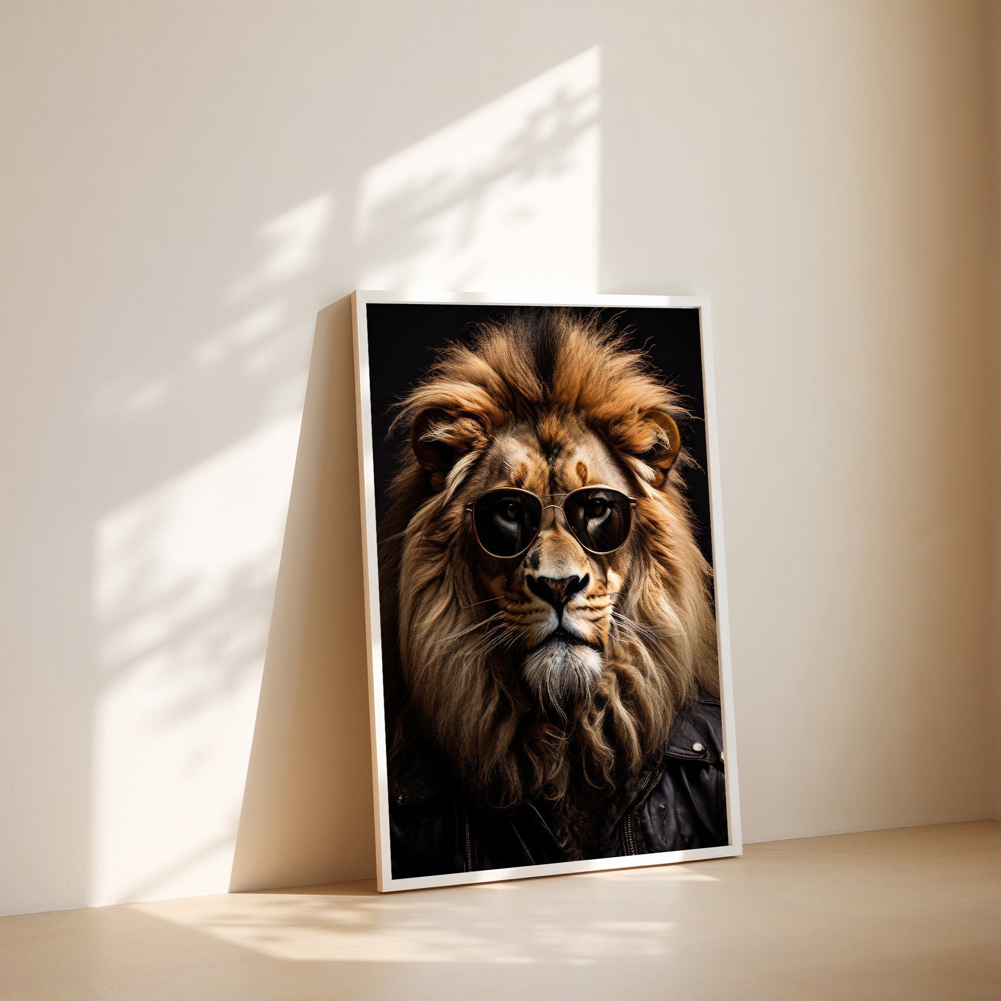 Framed artwork of a lion wearing sunglasses on a white wall.