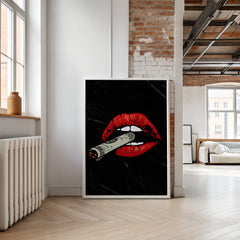 Modern interior with a framed artwork of red lips holding a dollar bill on a black background.
