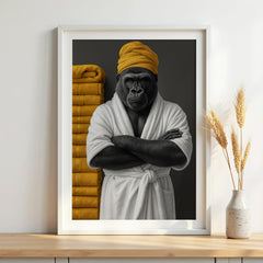 Framed artwork of a gorilla in a robe and yellow headscarf on a wall.