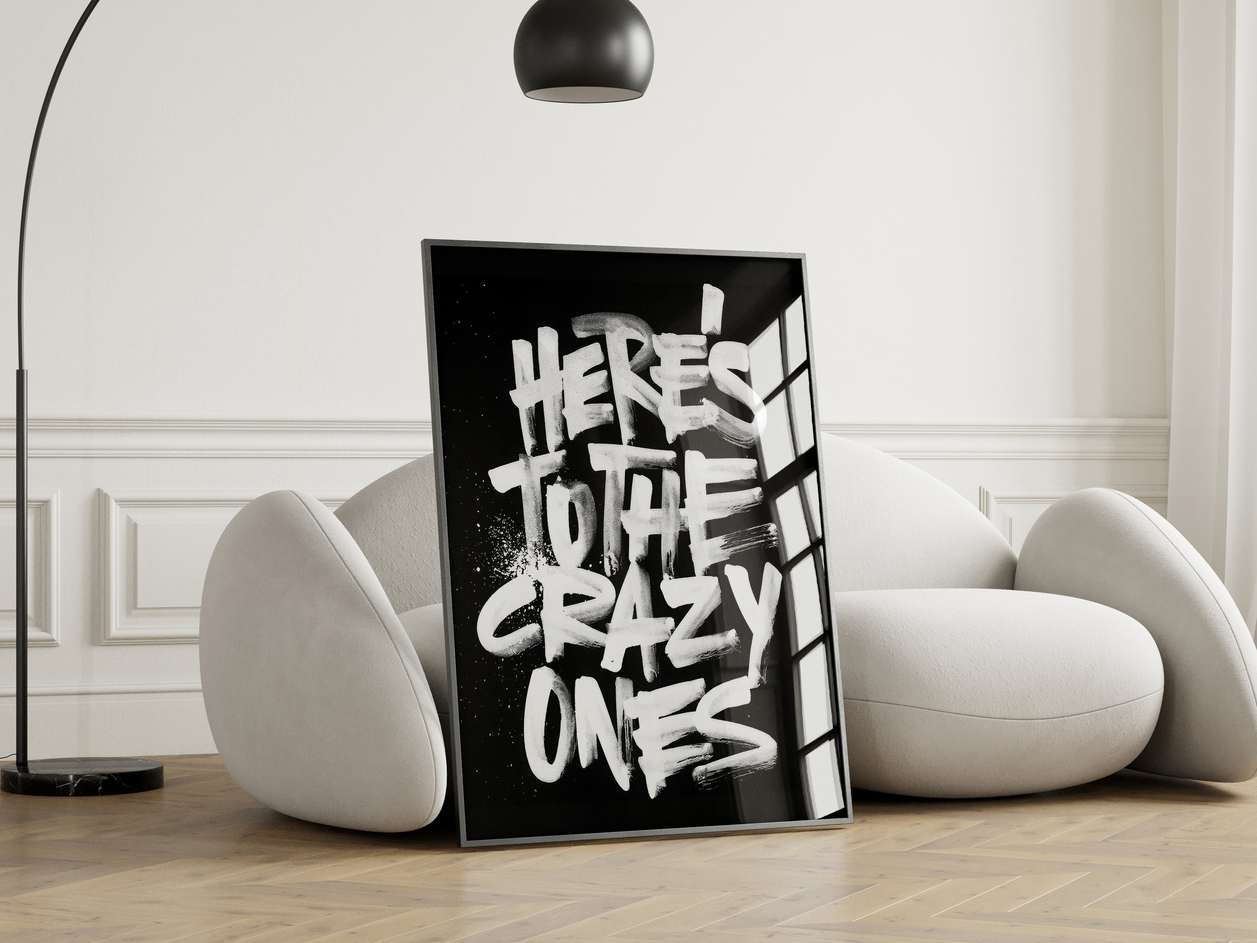 Framed artwork with text in a modern living room setting