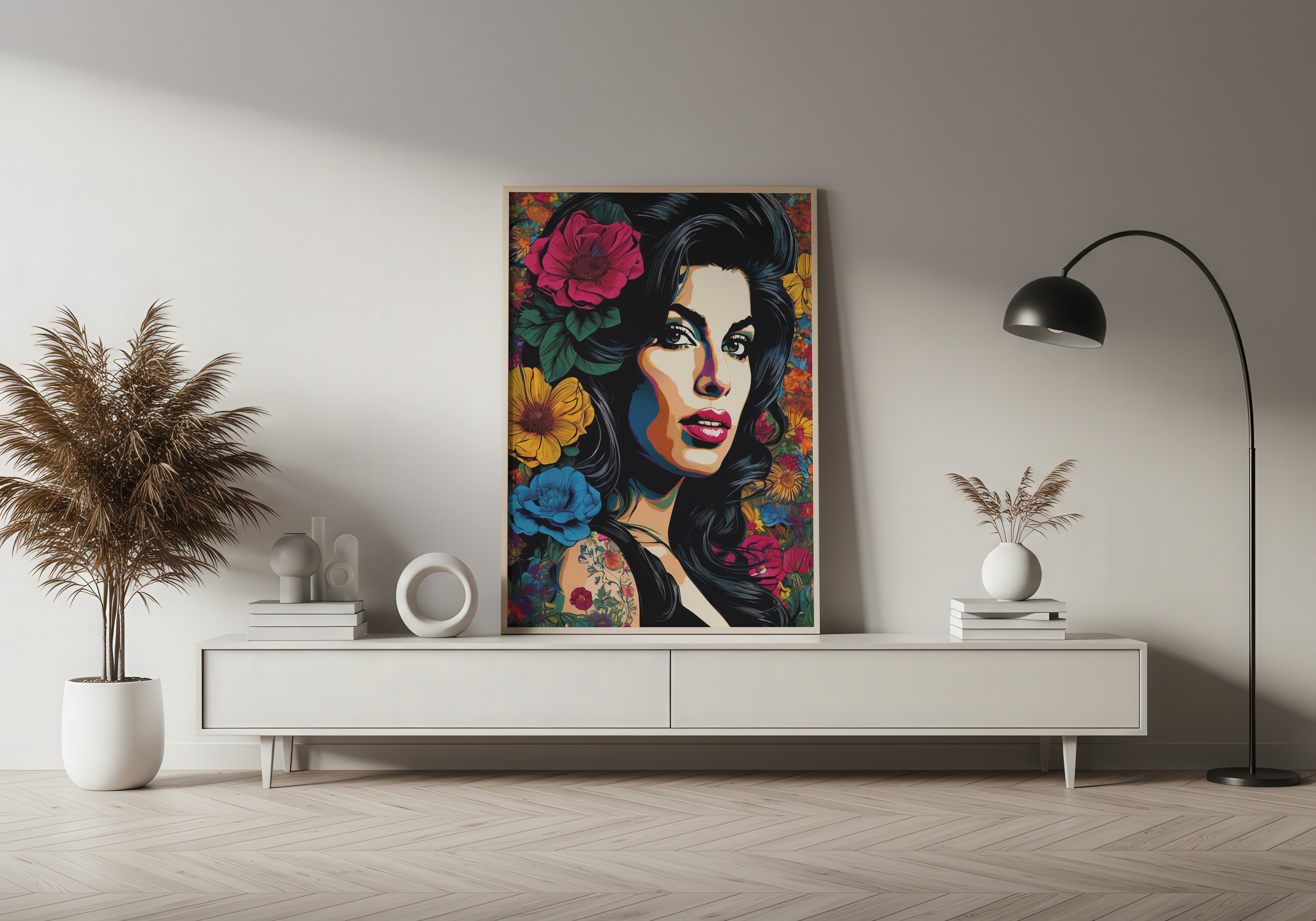 Colorful artwork of a woman's face with flowers on a wall above a white console table.